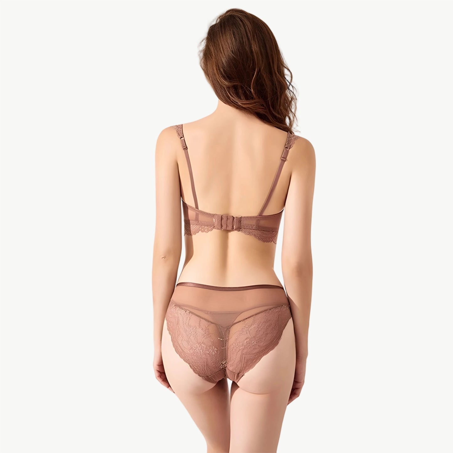 Woman wearing a brown lingerie set on a white background